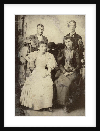 Portrait of two men and two women standing and sitting in front of a painted backdrop, lighthouse by Anonymous