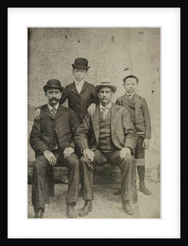Portrait of two men and two boys, standing and sitting in front of a painted backdrop (pond?) by Anonymous
