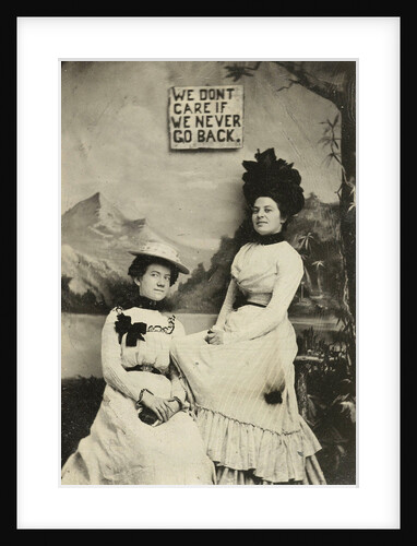 Portrait of two women standing and sitting in front of a painted backdrop (mountains) and the text WE DO NOT CARE IF WE NEVER GO BACK by Anonymous