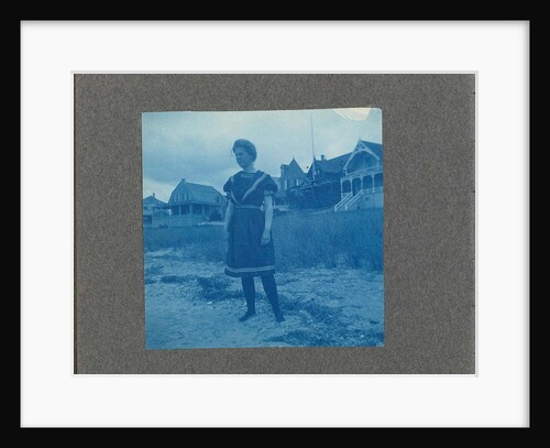 Woman posing for wooden houses, United States, USA by Anonymous