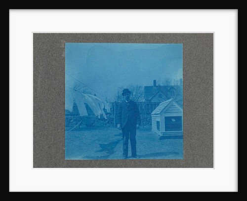 Man standing on a clothesline in a garden, USA by Anonymous