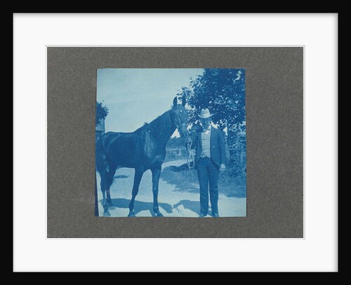 Man holds horse by the reins, United States, USA by Anonymous