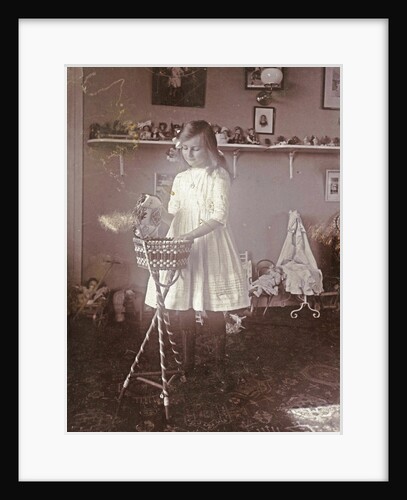 Portrait of Sacha, the eldest daughter of the photographer, in a room with toys by Henry Pauw van Wieldrecht