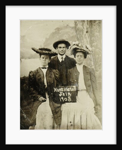 Portrait of a man and two women in front of a painted backdrop (tree, lake and mountains) and a sign that read 'Huntington FAIR 1905 by Anonymous