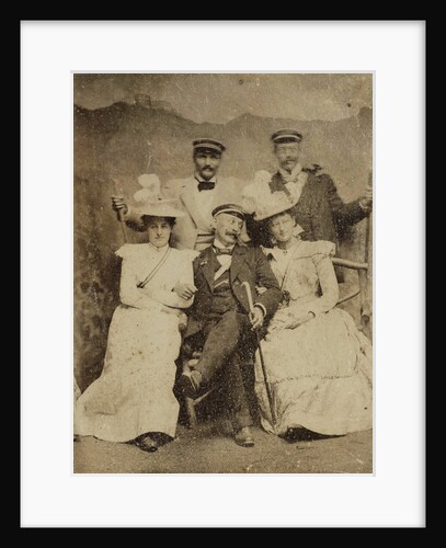Group portrait of three men and two women in visible cheerful mood, standing and sitting in front of a painted backdrop showing a mountain castle by Anonymous