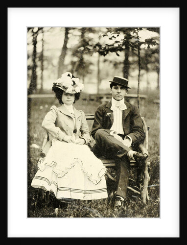 Portrait of a man and woman sitting on a bench in a forest or park setting by Anonymous
