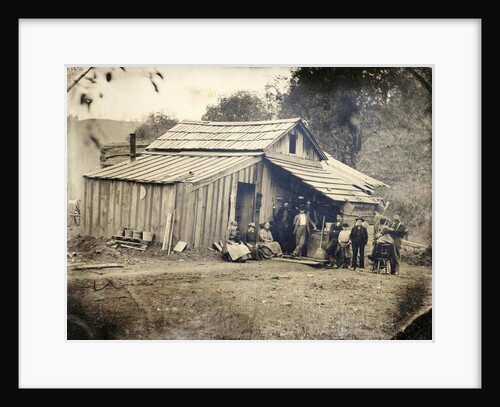 View of a wooden house with ten people, one of whom cut and / or shaved by Anonymous