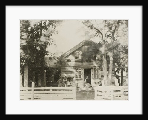 View of a wooden house, with five people and a dog by Anonymous