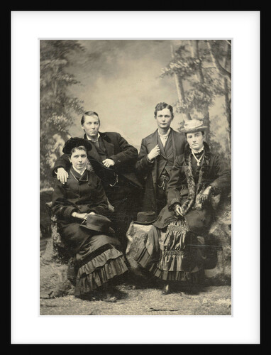 Two men and two women standing and sitting in front of a painted backdrop (forest) by Anonymous