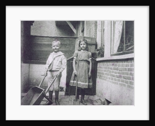 Two children, with wheelbarrow and shovel by Anonymous
