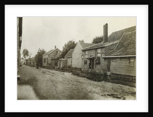 Village street with wooden houses by Anonymous