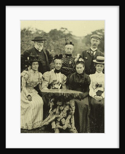 Group portrait of five women and two men around a table in the open air by Anonymous