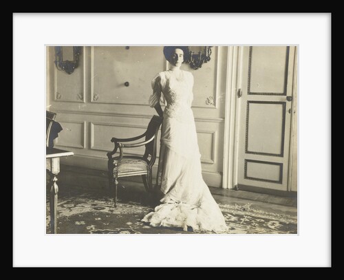 Unidentified woman standing in an interior by Anonymous