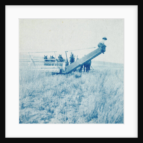 Farmers in a combine harvester, waiting laadkar by Anonymous