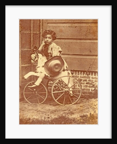 Louis Asser, son of the photographer, on a tricycle by Eduard Isaac Asser