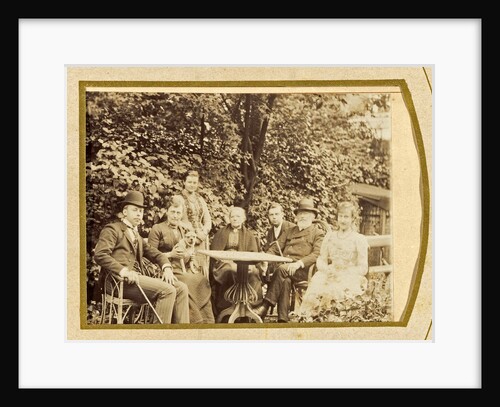 Family portrait on garden table with dog by A. Th. Baert