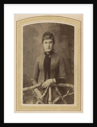 Portrait of a woman in a dress on a fence by J.H. van der Laag