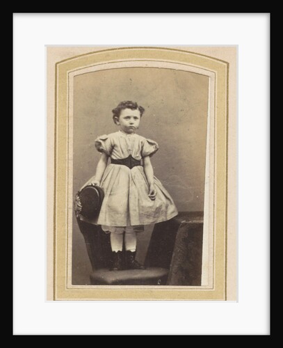 Portrait of a girl in a dress with a belt on a chair by K. Karsen