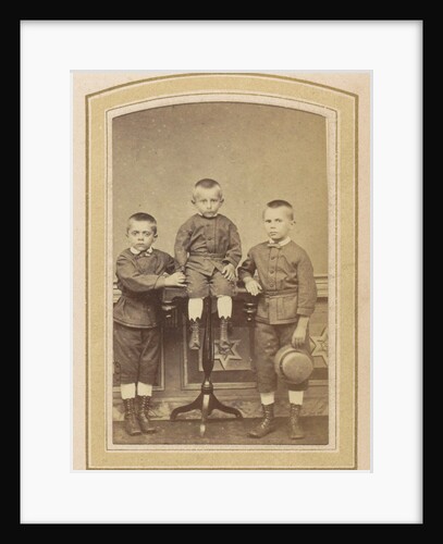 Portrait of three children in suits and boots by L.H. Serré