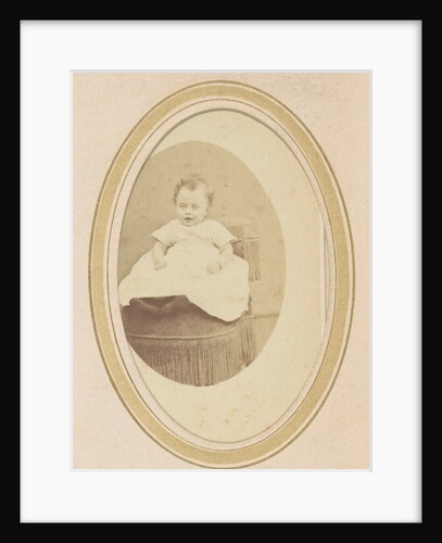 Portrait of a baby in a dress on a chair by Anonymous