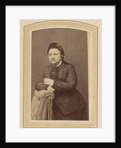 Portrait of a woman with a hat leaning on an armchair by Johannes H. Kramer