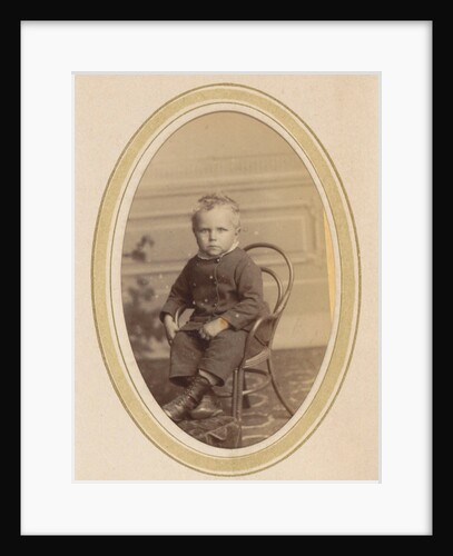 Portrait of a child on a chair with lace-up boots and a packet by J.C. Reesinck
