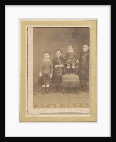 Portrait of four children in a chair by Anonymous
