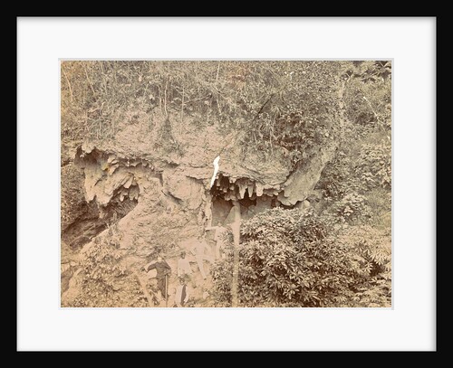 Men at a hanging stone in Batoe Gantong in Ambon by Anonymous