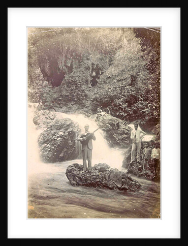 Guitar playing man at a waterfall at Batu Gantong in Ambon, Indonesia by Anonymous
