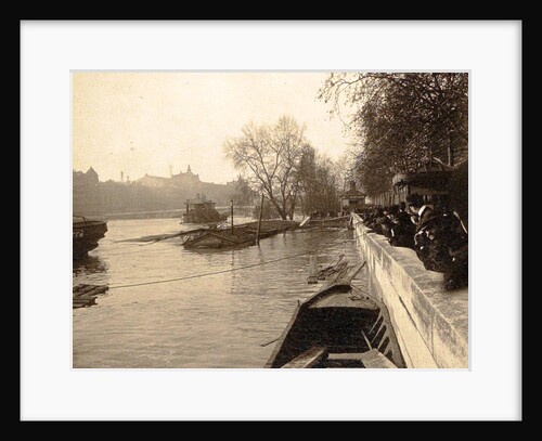 People watching from the wharf to the high water level of the Seine in Paris by Anonymous