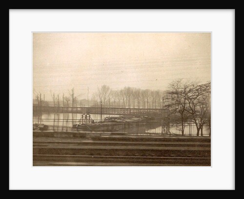 Vessels under a bridge during the flood of Paris, seen from a train, France by Anonymous