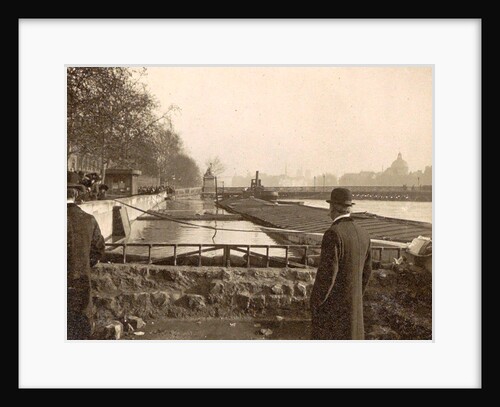 People look at the high elevations of the Seine during the flooding of Paris by France