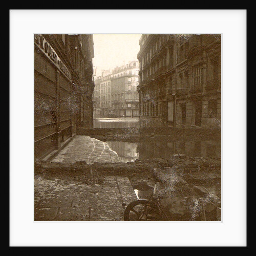 Flooded street with dams and a wheelbarrow by Anonymous