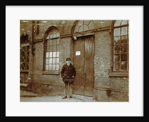 Man standing in front of an office door by Anonymous