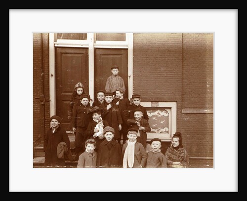 Group of children posing on stairs for entrance doors by Anonymous