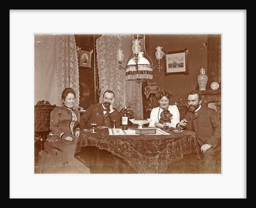 Two men and two women sitting around a table with glasses of wine by Anonymous