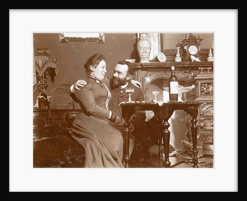 Woman on a man's lap with glass of wine in a living room by Anonymous