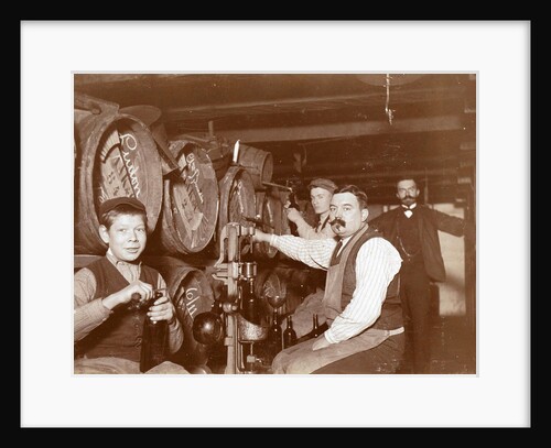 Brouwer and clerks in wine barrels and a corking machine by Anonymous