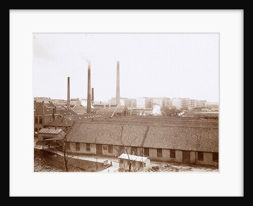 Exterior of factory buildings with chimneys, in the foreground wooden barrels by Anonymous