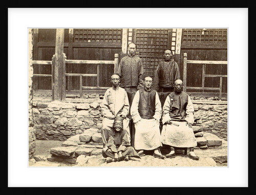Chinese men and a boy near a house in Tibet by D.T. Dalton