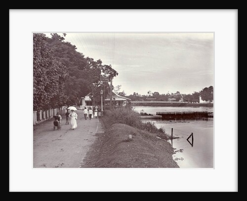 Hikers on a riverbank in Surabaya and in the background the Goebengbrug, Indonesia by Anonymous