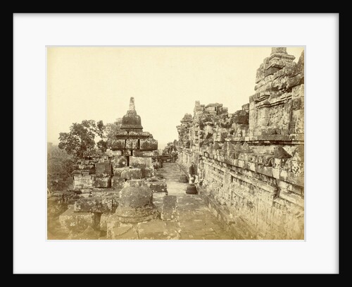 Indian man on a relationship of Borobudur in Java, Indonesia by Anonymous