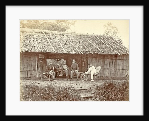 Dutch soldiers sitting in front of a wooden house in the Dutch East Indies by Anonymous