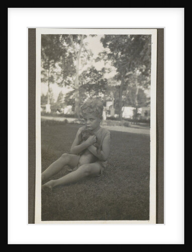 Sitting boy with a dog in his arms by Anonymous