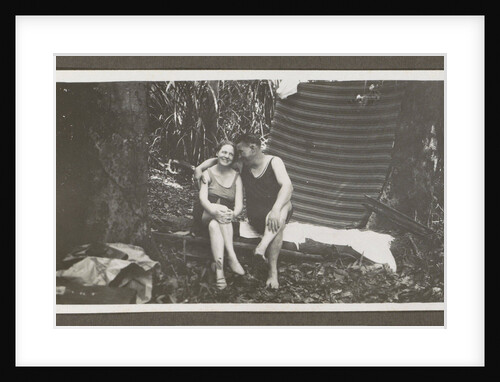 Man and a woman in swimwear on a bench in a forest by Anonymous