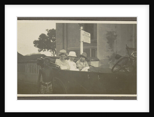 Triad sitting in the backseat of a car, leading a boy by Anonymous