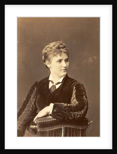 Studio Portrait of a woman sitting on a chair with curved back by Anonymous