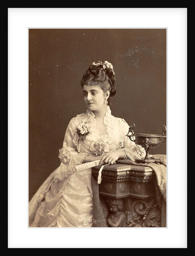 Studio Portrait of a woman sitting next to a tazza with fan in hand by Anonymous