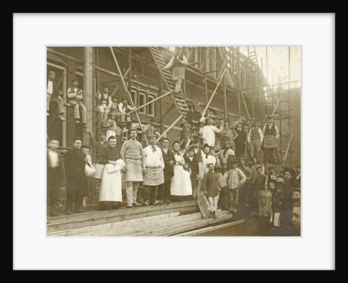 Group portrait of workers at a house under construction by Centraal Photographie Atelier