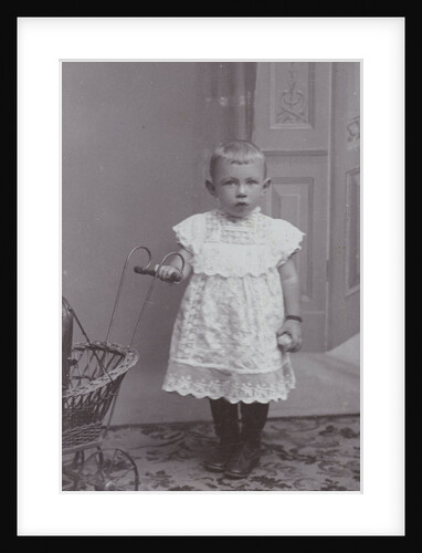 Studio portrait of girl with doll carriage by J.L.T. Huijsen
